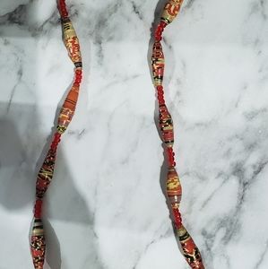 Hand made paper necklaces.